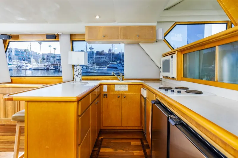 Slide: The Image of Luxurious kitchen interior of 1996 Navigator 5300 Classic yacht with marina view. - 35