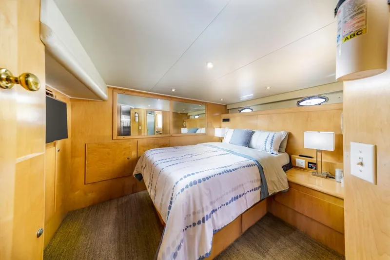 Slide: The Image of Luxurious bedroom interior of 1996 Navigator 5300 Classic yacht with modern amenities. - 38
