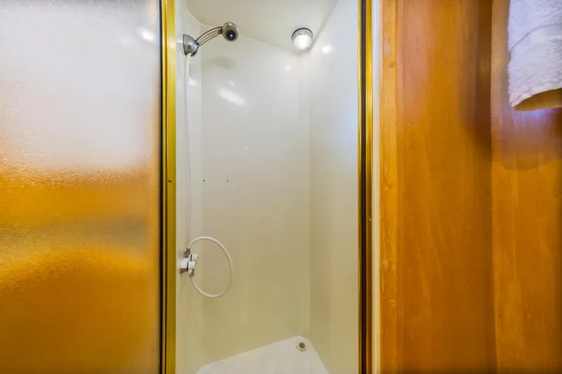 Slide: The Image of Shower area in 1996 Navigator 5300 Classic yacht with wooden accents. - 42