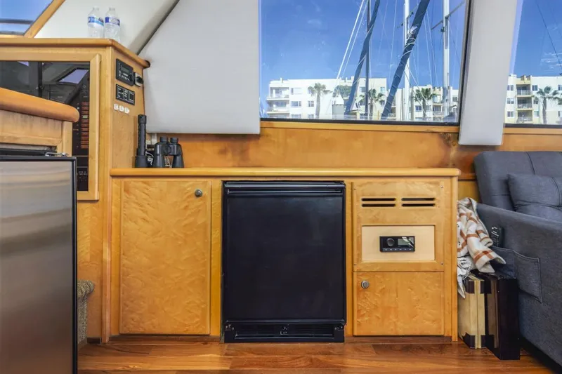 Slide: The Image of Interior of 1996 Navigator 5300 Classic yacht with wooden cabinetry and modern amenities. - 50