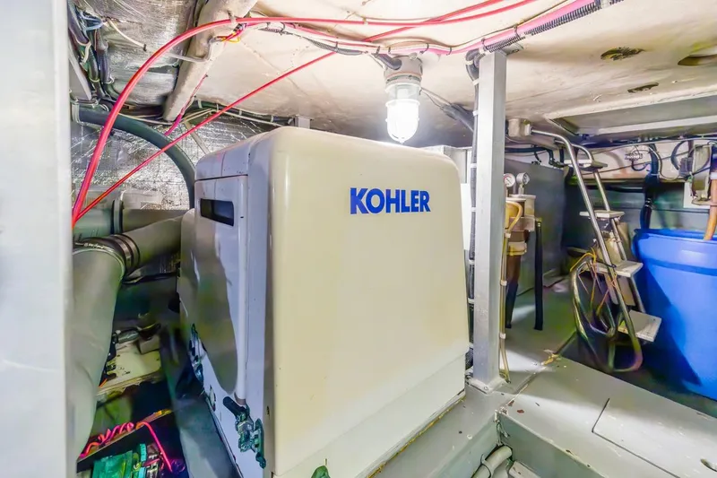 Slide: The Image of Engine room of 1996 Navigator 5300 Classic with Kohler generator and wiring. - 61