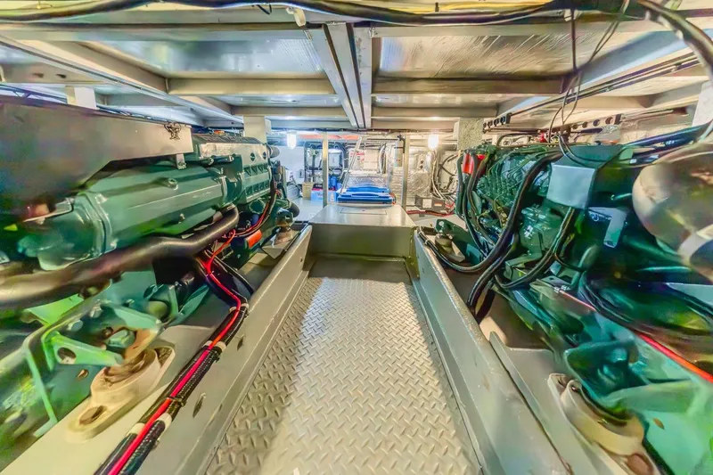 Slide: The Image of Engine room of 1996 Navigator 5300 Classic yacht, showcasing dual engines and mechanical systems. - 63