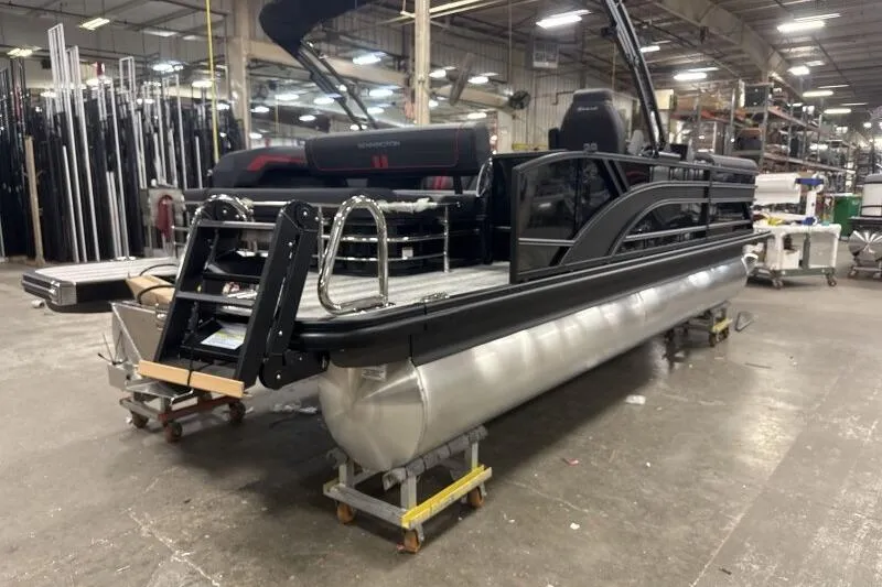 Slide: The Image of 2026 Bennington 23 SSBSF pontoon boat in a factory setting. - 10