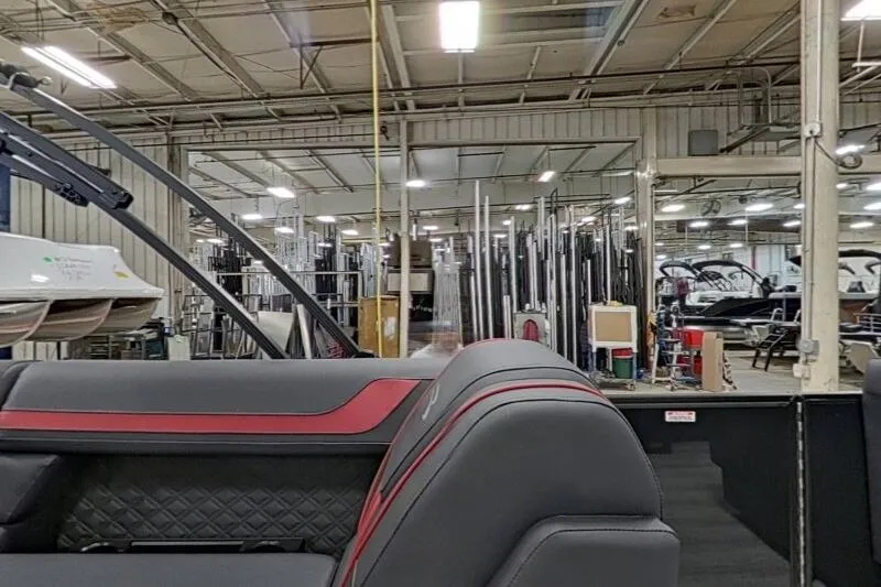 Slide: The Image of 2026 Bennington 23 SSBSF boat interior in a manufacturing facility. - 12