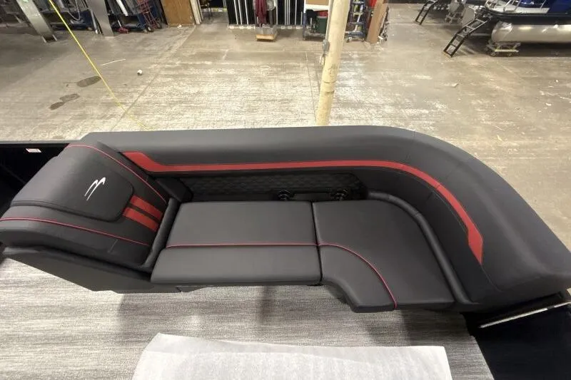 Slide: The Image of 2026 Bennington 23 SSBSF boat interior with sleek black and red seating design. - 14