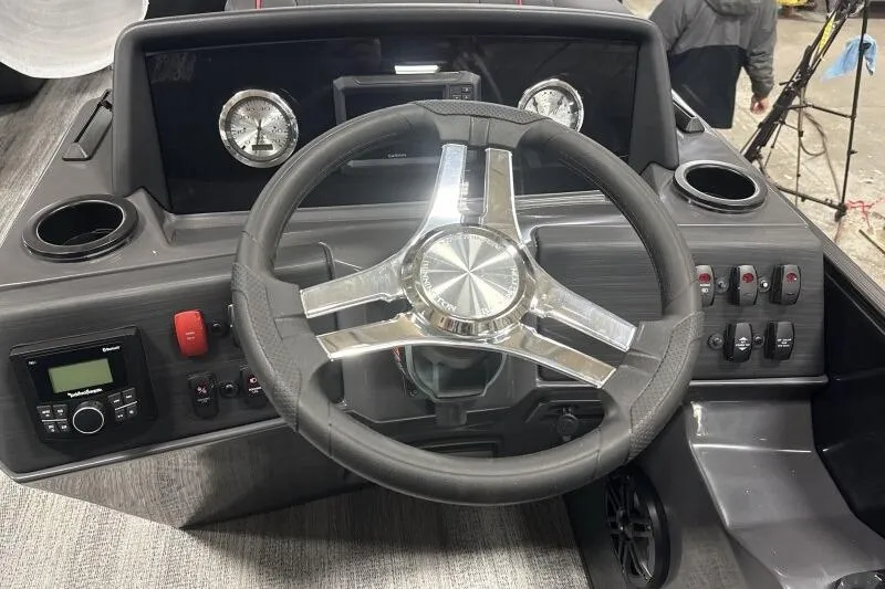 Slide: The Image of 2026 Bennington 23 SSBSF boat dashboard with steering wheel and controls. - 18