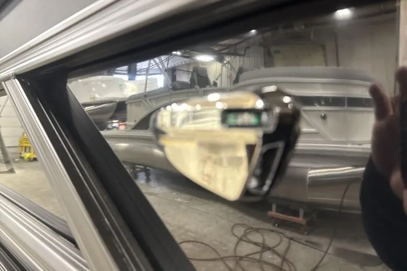 Slide: The Image of Close-up of 2026 Bennington 23 SSBSF boat detail in a showroom. - 21