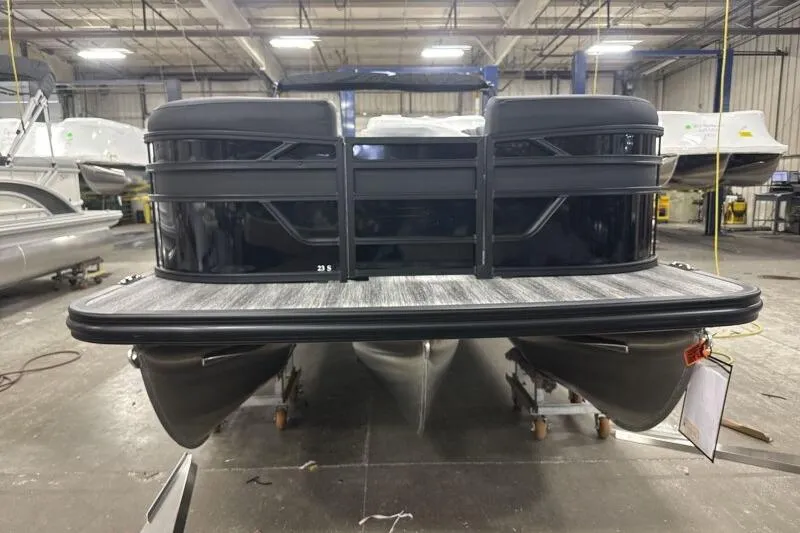Slide: The Image of 2026 Bennington 23 SSBSF pontoon boat in a showroom, front view. - 5