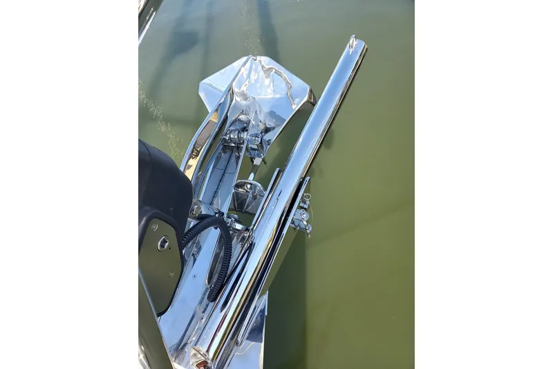 Slide: The Image of 2023 Bluewater 56 yacht illuminated at night in a marina setting. - 10