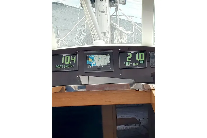 Slide: The Image of Bluewater 56 sailboat with lion emblem on sail, 2023 model, under clear sky. - 15