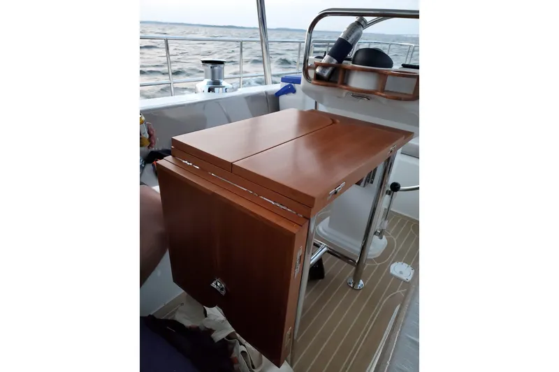 Slide: The Image of 2023 Bluewater 56 sailboat on open sea under a partly cloudy sky. - 16