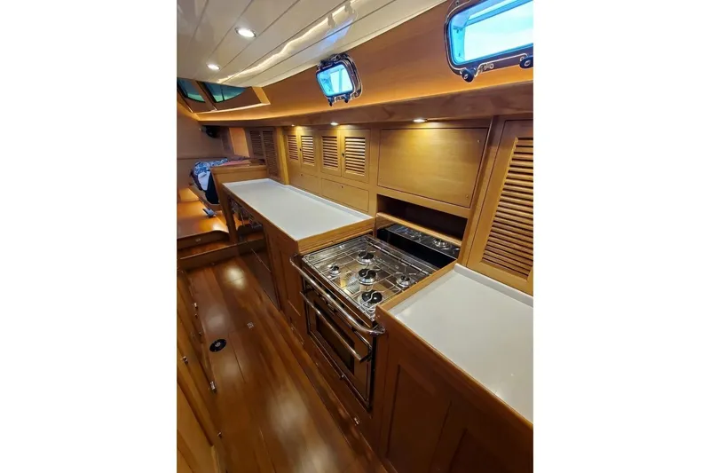 Slide: The Image of Sailing on a 2023 Bluewater 56 yacht at sunset, ocean view. - 26