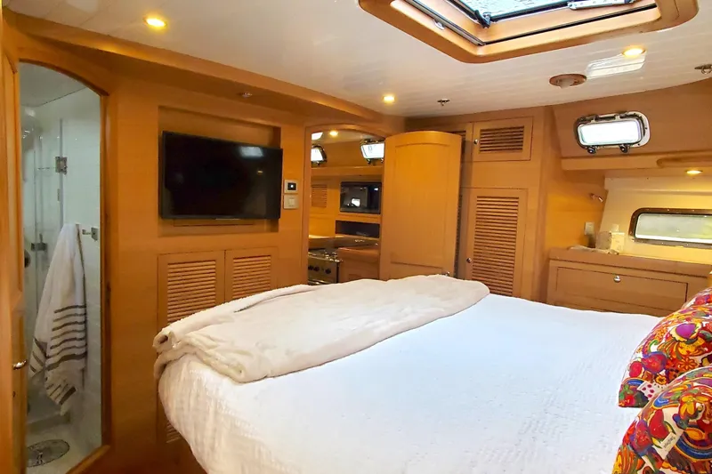 Slide: The Image of Luxurious bathroom in 2023 Bluewater 56 yacht with shower and wooden cabinetry. - 42