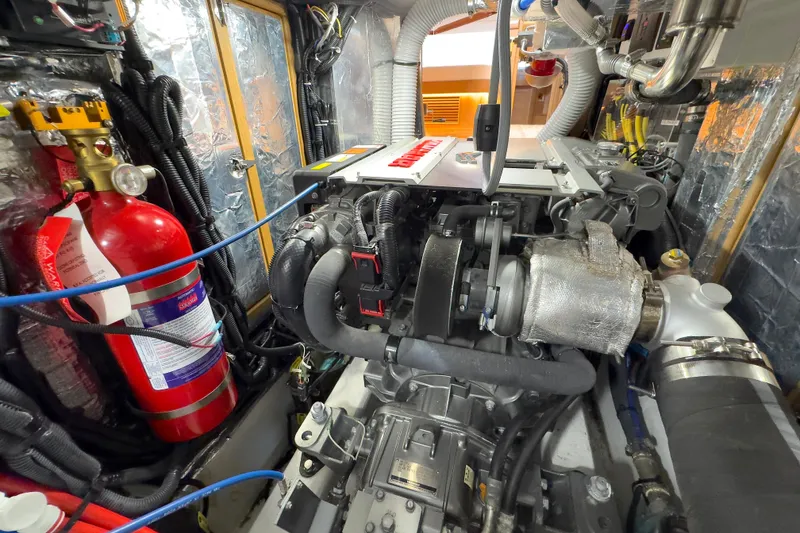 Slide: The Image of Engine room of 2023 Bluewater 56 yacht with equipment and wiring. - 53