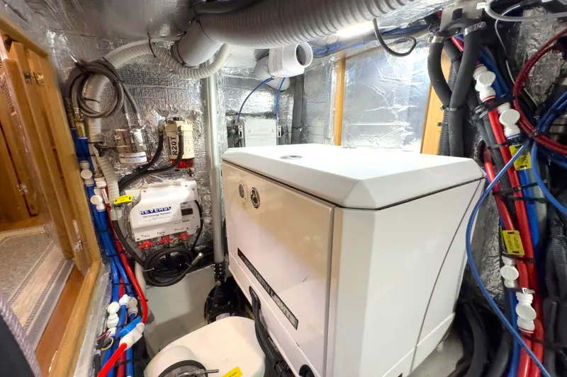 Slide: The Image of Engine room of 2023 Bluewater 56 yacht featuring Northern Lights generator and equipment. - 54