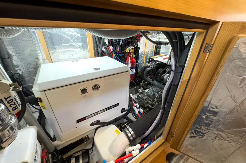 Slide: The Image of Engine room of 2023 Bluewater 56 yacht with Northern Lights generator and equipment. - 55