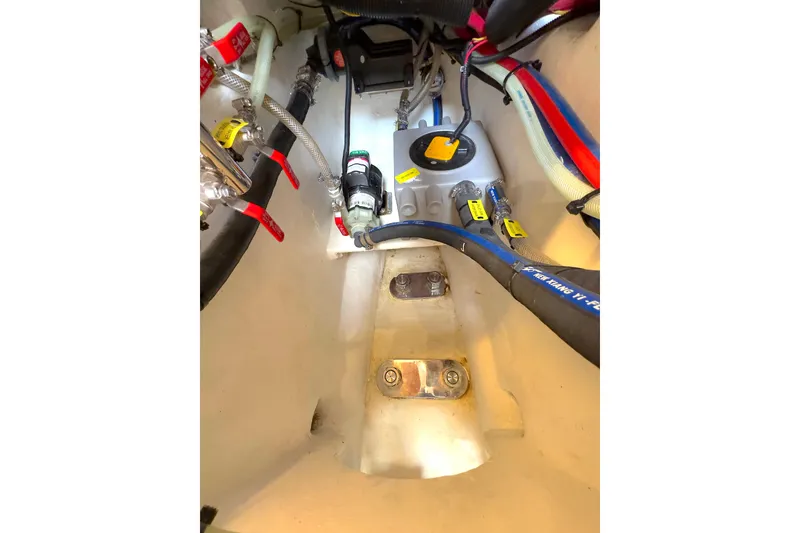 Slide: The Image of Electrical components inside a 2023 Bluewater 56, featuring wiring and circuit connections. - 57