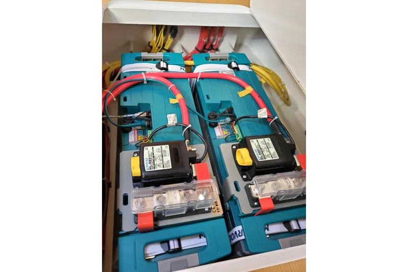 Slide: The Image of Electrical system inside a 2023 Bluewater 56 yacht, featuring wiring and components. - 58