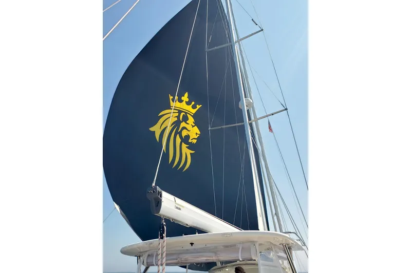 Slide: The Image of 2023 Bluewater 56 yacht sailing on calm waters under clear blue skies. - 8