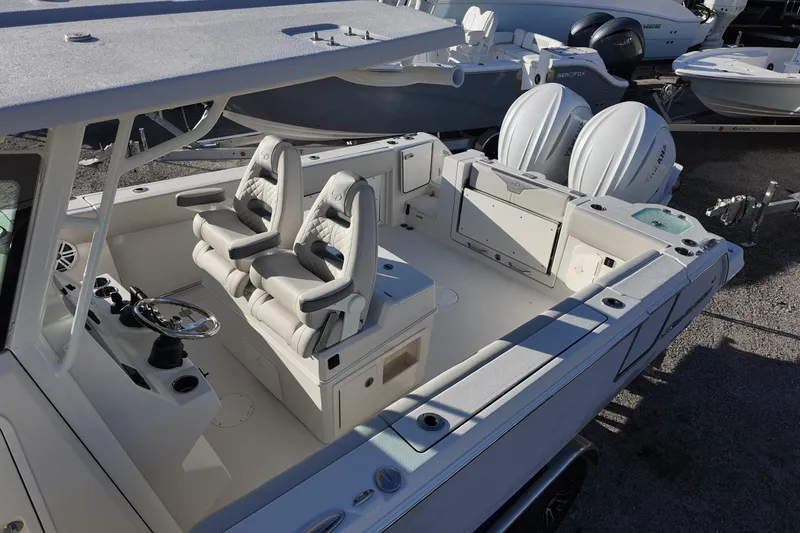 Slide: The Image of 2026 Sailfish 312 CC boat interior with dual seats and twin outboard engines. - 14