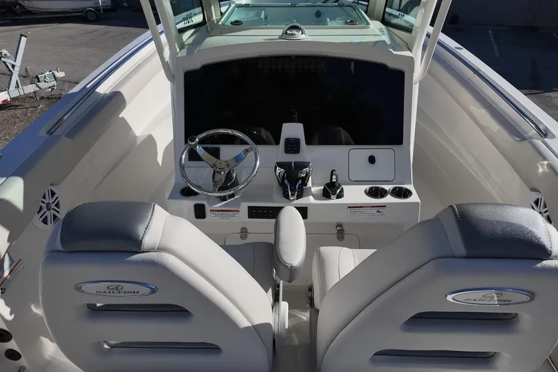 Slide: The Image of 2026 Sailfish 312 CC boat cockpit with steering wheel and control panel. - 17