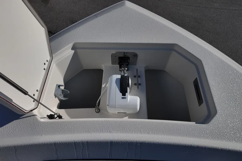 Slide: The Image of 2026 Sailfish 312 CC anchor compartment with open hatch, showcasing storage and anchor mechanism. - 23