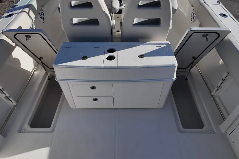 Slide: The Image of 2026 Sailfish 312 CC boat interior with storage compartments and seating. - 24