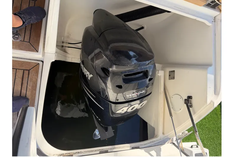 Slide: The Image of 2014 Sea Ray 370 Venture with Mercury Verado 400 outboard engine in boat compartment. - 13
