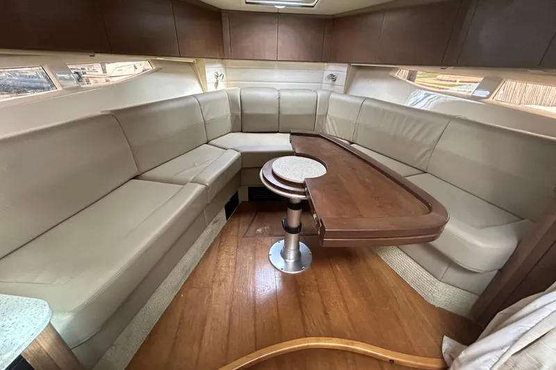 Slide: The Image of Luxurious interior of 2014 Sea Ray 370 Venture yacht with elegant seating and wooden table. - 22