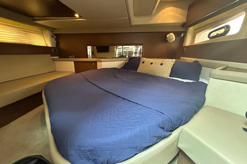 Slide: The Image of Luxurious cabin interior of 2014 Sea Ray 370 Venture with cozy bed and modern design. - 24