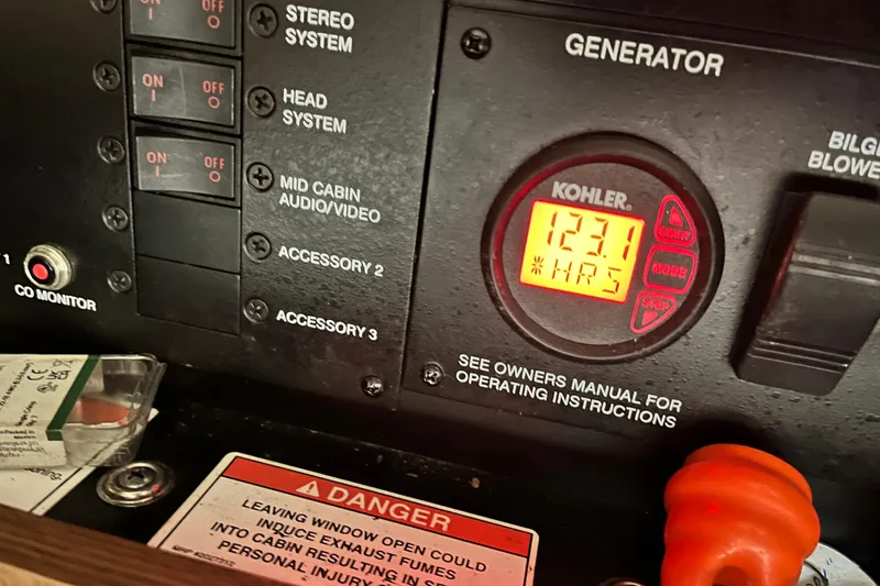 Slide: The Image of Control panel of a 2014 Sea Ray 370 Venture boat with Kohler generator display. - 32