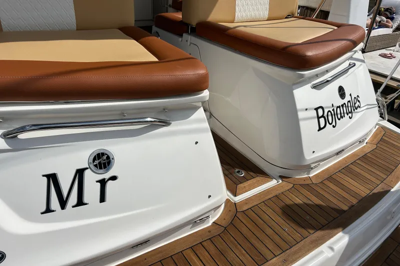 Slide: The Image of 2014 Sea Ray 370 Venture boat with "Mr Bojangles" name on teak deck. - 51