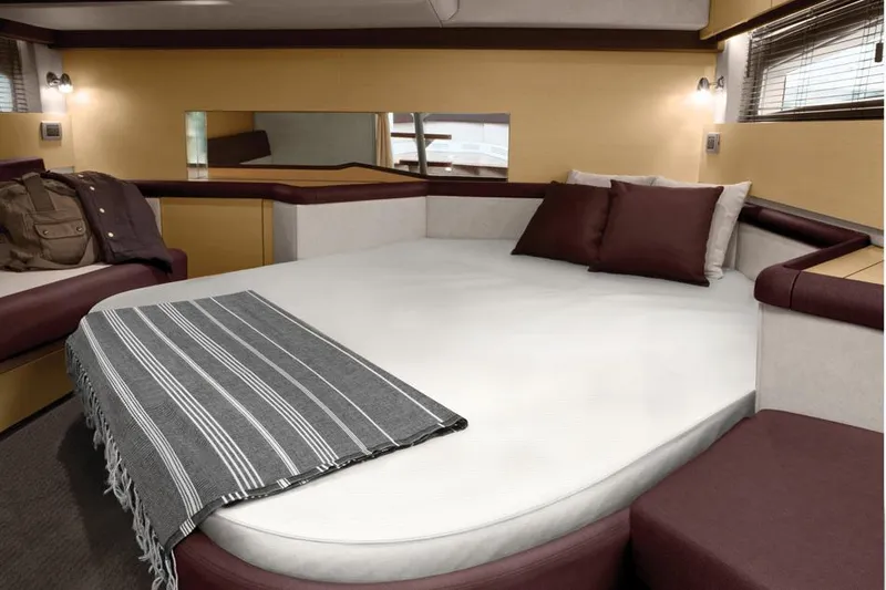 Slide: The Image of Manufacturer Provided Image: Luxurious cabin interior of 2014 Sea Ray 370 Venture with cozy bed and modern decor. - 7