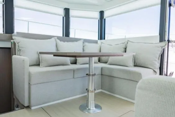 Slide: The Image of 2024 Leopard 40 Powercat interior with modern seating and table arrangement. - 14