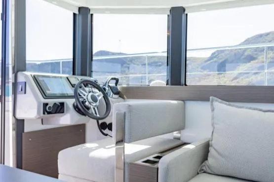 Slide: The Image of Interior of 2024 Leopard 40 Powercat with modern helm and plush seating. - 16