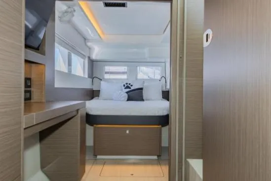 Slide: The Image of 2024 Leopard 40 Powercat cabin interior with modern design and cozy bedding. - 18