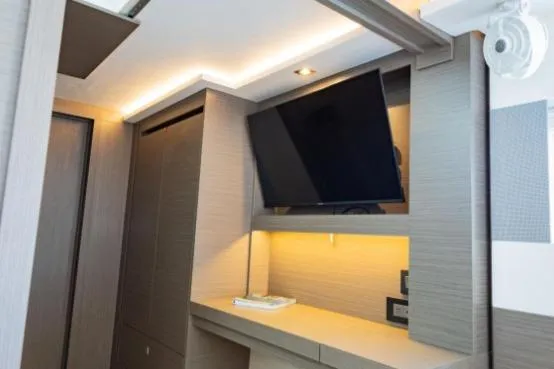 Slide: The Image of Interior of 2024 Leopard 40 Powercat with modern TV and ambient lighting. - 20