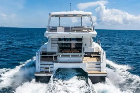 Slide: The Image of 2024 Leopard 40 Powercat cruising on open sea, rear view. - 3