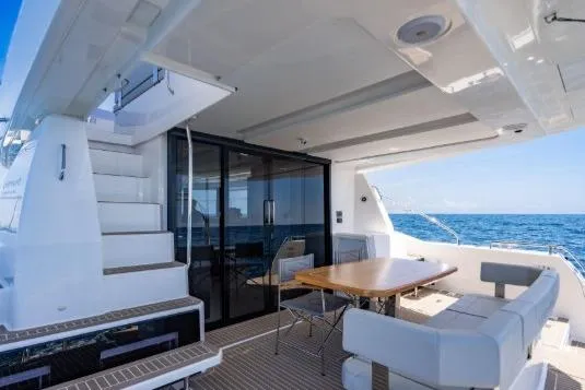 Slide: The Image of 2024 Leopard 40 Powercat yacht with spacious deck, seating, and ocean view. - 4