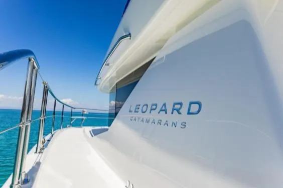 Slide: The Image of 2024 Leopard 40 Powercat yacht on clear blue ocean waters. - 6