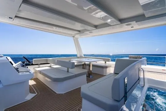 Slide: The Image of 2024 Leopard 40 Powercat yacht interior with ocean view, featuring modern seating and helm station. - 9