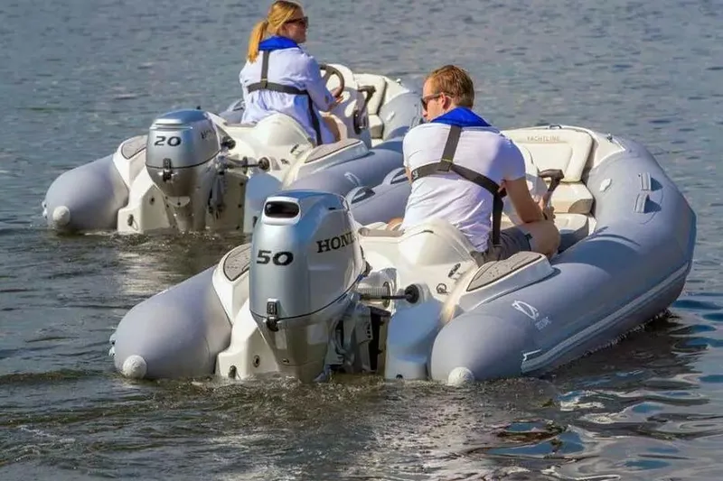 Slide: The Image of Two Zodiac Yachtline 360 boats with Honda engines on the water, 2026 model. - 5