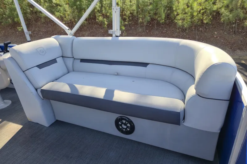 Slide: The Image of 2022 Godfrey Sweetwater 2286 SB boat seating with gray upholstery and speaker. - 11