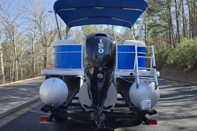 Slide: The Image of 2022 Godfrey Sweetwater 2286 SB pontoon boat with 150 HP engine on trailer. - 4