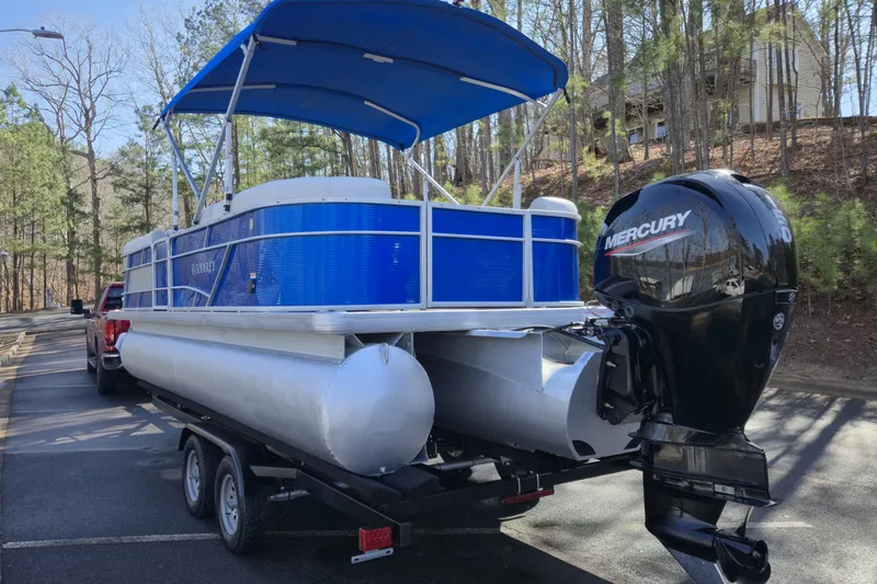 Slide: The Image of 2022 Godfrey Sweetwater 2286 SB pontoon boat with Mercury engine on trailer. - 5