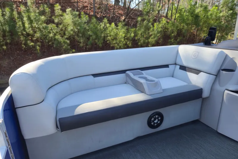 Slide: The Image of 2022 Godfrey Sweetwater 2286 SB boat interior with cushioned seating and cup holders. - 8