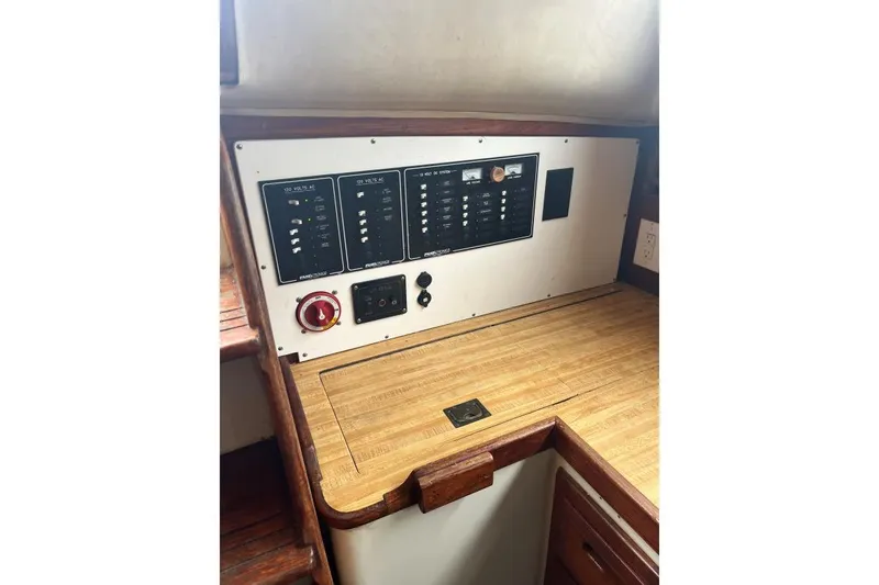Slide: The Image of Electrical panel on 1979 Downeaster 38 sailboat with wooden countertop. - 15