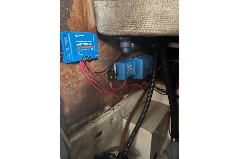 Slide: The Image of Electrical setup with Victron charge controllers in a 1979 Downeaster 38 boat. - 18