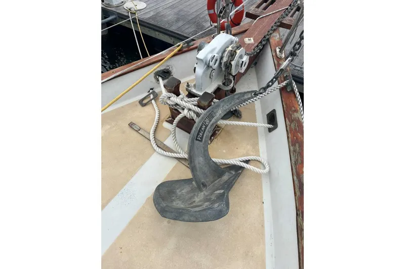 Slide: The Image of Anchor and winch on 1979 Downeaster 38 sailboat deck, dockside view. - 5
