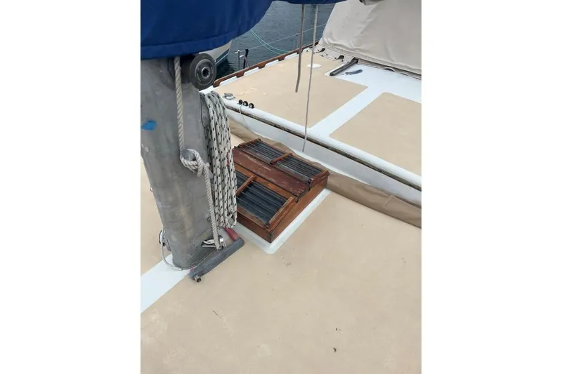 Slide: The Image of Deck of 1979 Downeaster 38 sailboat with mast and wooden hatch. - 7
